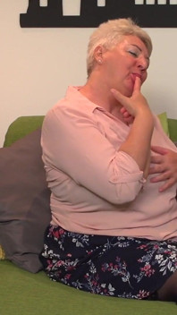 Big Butt Granny Astrid Fingers Her Mature Pussy on the Sofa