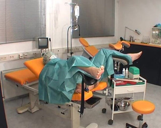 Rubber & Clinic Studio - 1ATOYS: Nurse in green surgery outfit