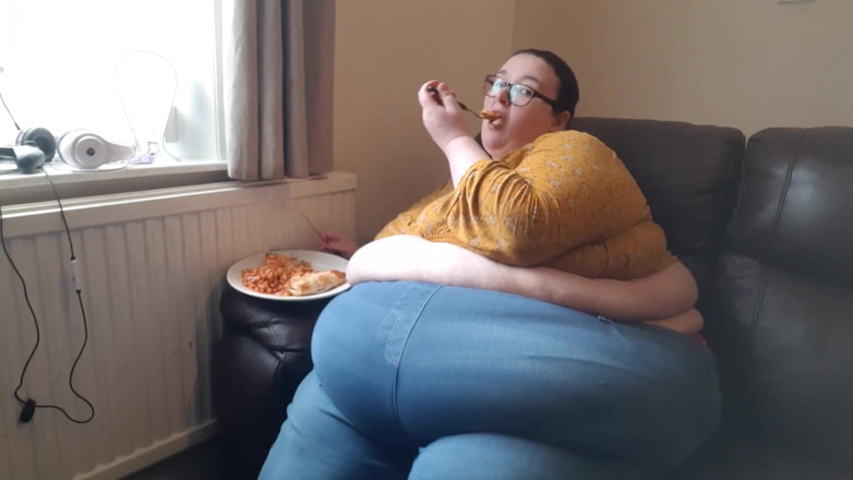 SSBBWLadyBrads: SSBBW huge belly whilst eating on sofa