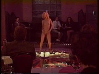 Irresistible Strippers: Blonde stripper bends showing shaved pussy