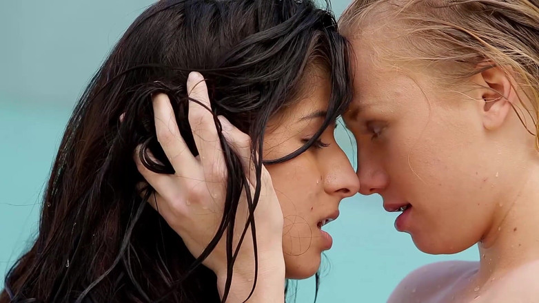 Lesbian Stories: Young lesbian beauties licking each others pussy in the swimming...