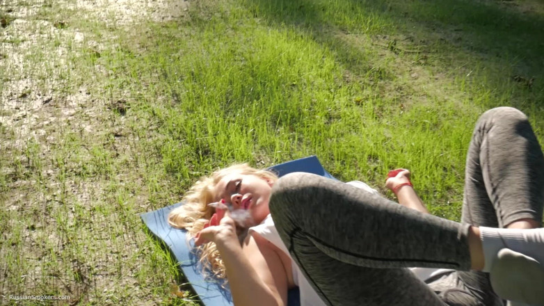 Russian Smokers: Sexy Russian Girl Smoking Cigarette Relaxed Outdoors