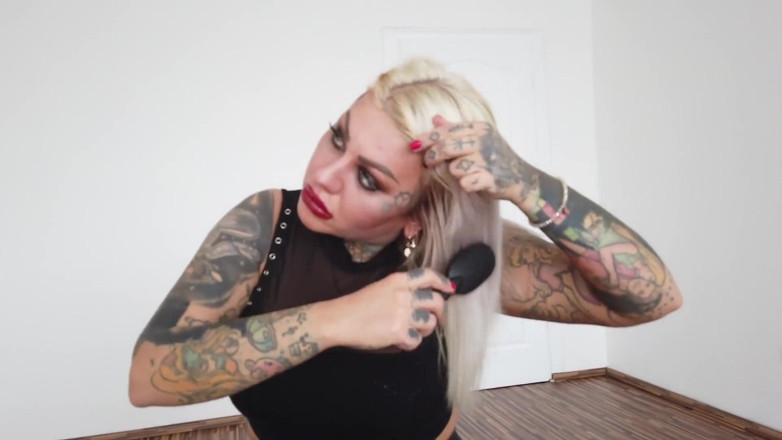 Fetish videos by Alex: Tattooed blonde MILF combing her hair.