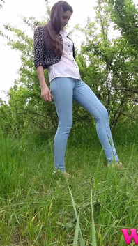 Skinny Brunette Just Had a Pee in the Tall Grass and Now She Puts on Her Jeans and Shoes