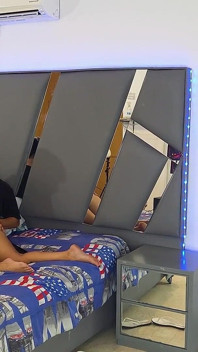 Stepmom Gives a Good Blowjob to Her Stepson in His Bed.