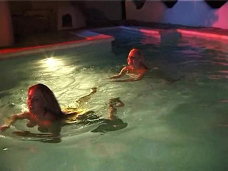 Naughty Girls: Two sexy lesbian chicks are swimming together in the swimming...