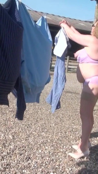 Trisha hanging out the washing