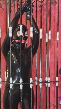 Imprisoned Rubber Slut Has to Give a Blowjob