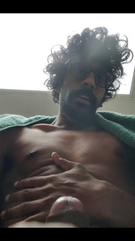 Masturbating