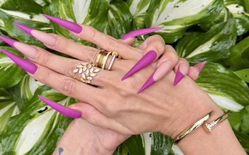 New Purple Color Long Nails Sharp Stilettos Palms Long Fingers in the Garden with Flowers
