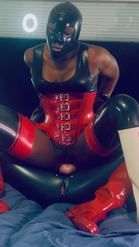 Rubber Babe Riding on the Cock