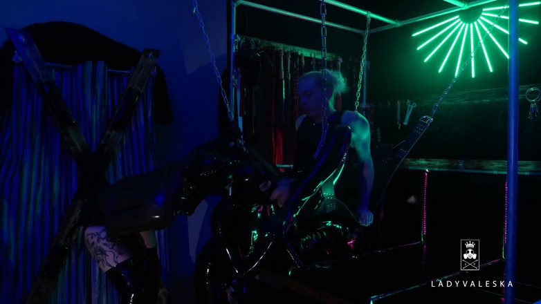 Lady Valeska: The rubber Domme the giant dildo and the gimp