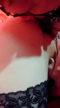 Mistress and guy slave with a dildo in his mouth.