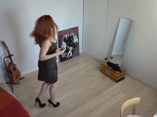 Milfs and Teens: Redhaired MILF in a Black Skirt Takes a Sexy Selfie...