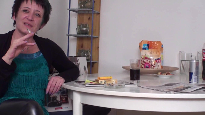 Femdom Austria: Brunette mature slut smoking a cigarette