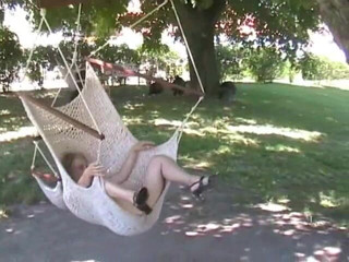 Femdom Austria: Pissing on a outdoor swing