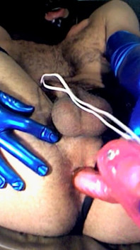 Latex Masked Sub in Stockings Fucks Its Ass with Huge Dildo