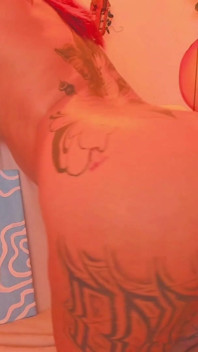 A Latina with a Tattooed Body Is Shaking Her Butt for You