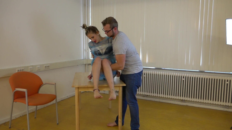 Restricting Ropes: Taped to their work desk