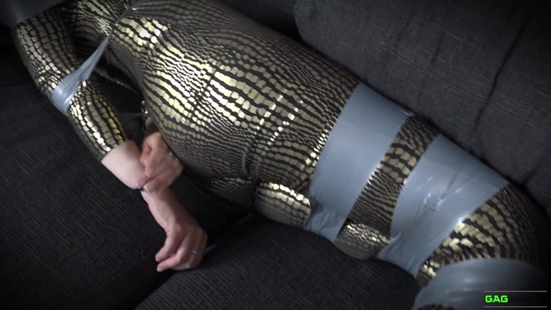 Gag Attack: Leila - unok in catsuit in bondage a nastro