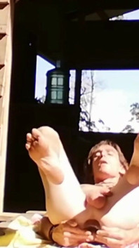 Young gay man opens his ass and sunbathes