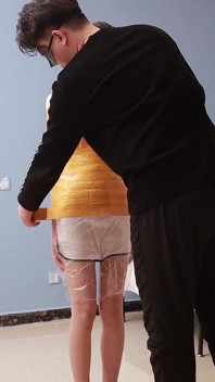 A Cute Barefoot Girlfriend Uses Tape to Bind Her Whole Body, Playing with Her Cute Bare Feet