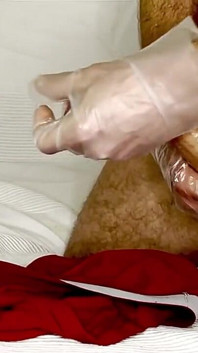 Man Jerking His Dick with Gloves on and, Cum on His Shorts