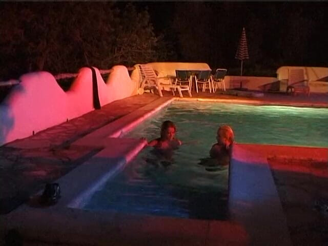 Naughty Girls: Two sexy lesbian chicks are swimming together in the swimming...