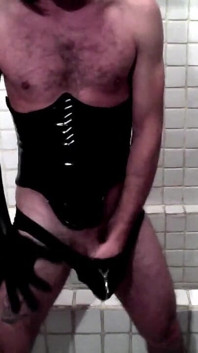 Latex Masked Sissy in Corset Cums in the Bathroom