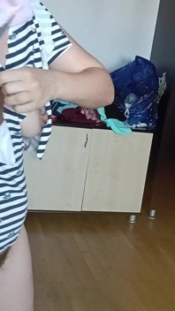 Amateur Woman Has Fun Trying on Clothes and Cutting Them