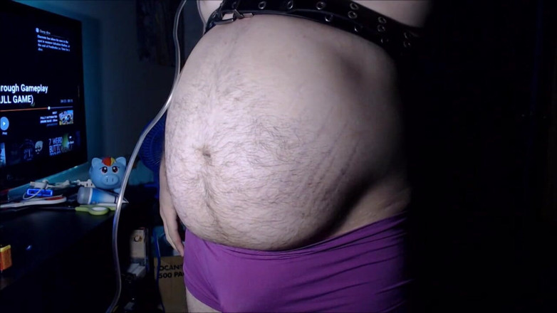 Akevantelico91: Belly inflation in purple boyshorts