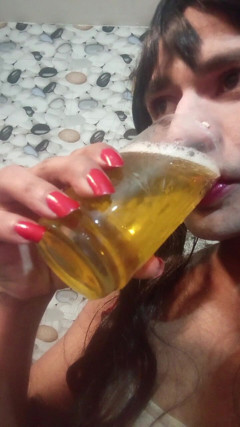Beautiful transgender drinking 2 glasses of urine