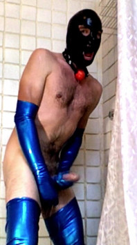 Latex Masked Sub in Stockings Fucks Its Ass with Huge Dildo
