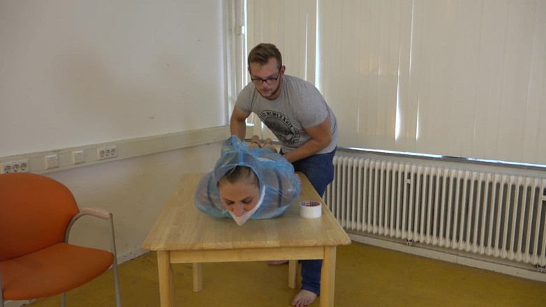 Restricting Ropes: Taped to their work desk