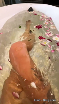 Bath of Blossoms Naked MILF Masturbates Among Flowers