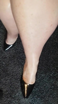 Shiny black heels.
