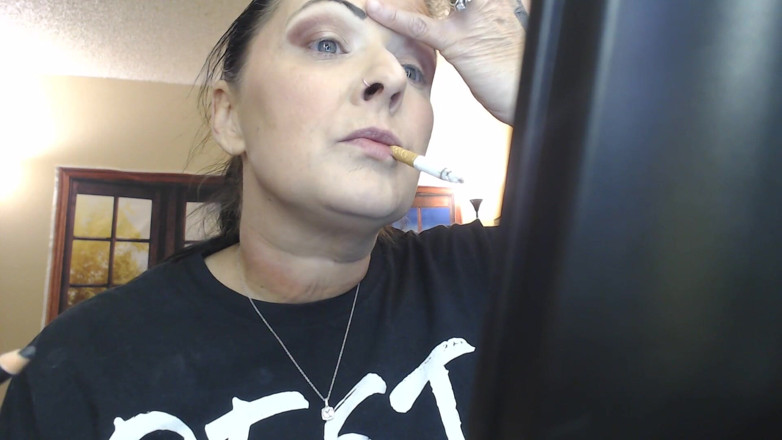 Abby Anna: Doing make up dangling smoke