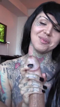 Tattooed beauty Britney Boykins strokes a big cock