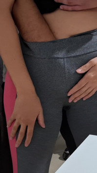 Masturbating Her Camel Toe on the Table with the Neighbor's Help.