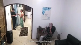 While the Husband Works, the Wife in a Towel Greets the Delivery Man