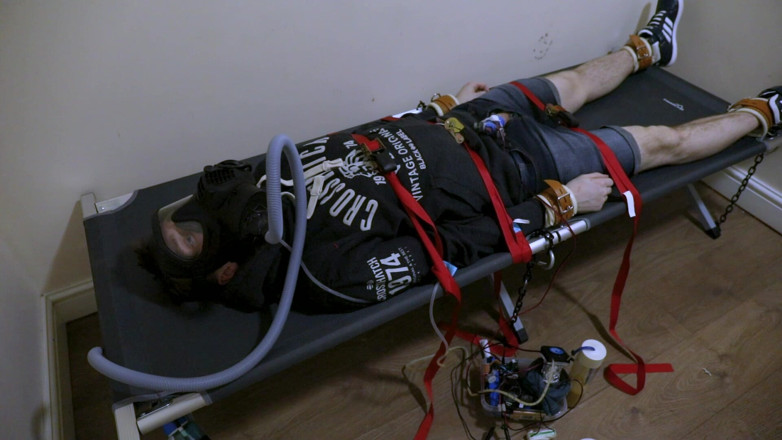Inmate Cody and SubEdgeX: Strapped Down Sub Fed by Automatic Feeder