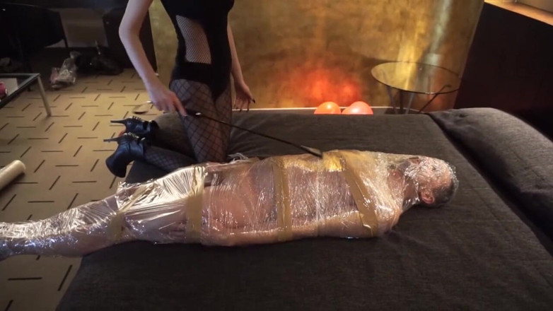 Lady Mesmeratrix Official: Femdom girl puts her slave in tape bondage