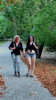 Two Lesbian Mistresses Are Strolling Through the Park