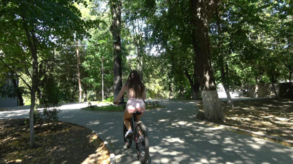 Kriss Kiss: The guy watches a sexy girl on a bicycle in...