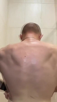 Alpha Shows off His Back Muscles