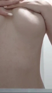 Putting on Lotion After a Shower at the Gym