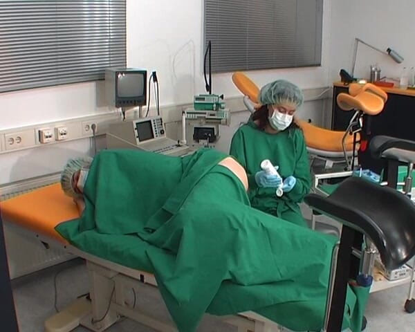 Rubber & Clinic Studio - 1ATOYS: Nurse in green surgery outfit