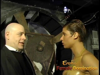 Erotic Female Domination: Tattooed femdom brunette talking dirty while squeezing slave's cock