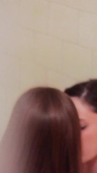 Cute brunette lesbians pleasuring each other in the bathroom