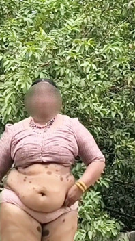 A Full-figured Woman in a White Skirt and Pink Top Strips Down and Walks Nude Outside
